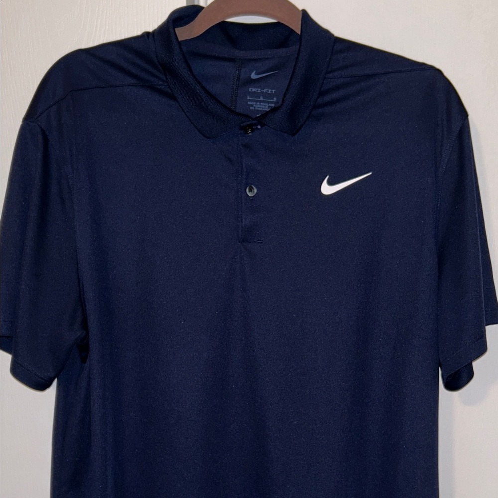 Nike golf dri fit Navy Polo with White Swoosh